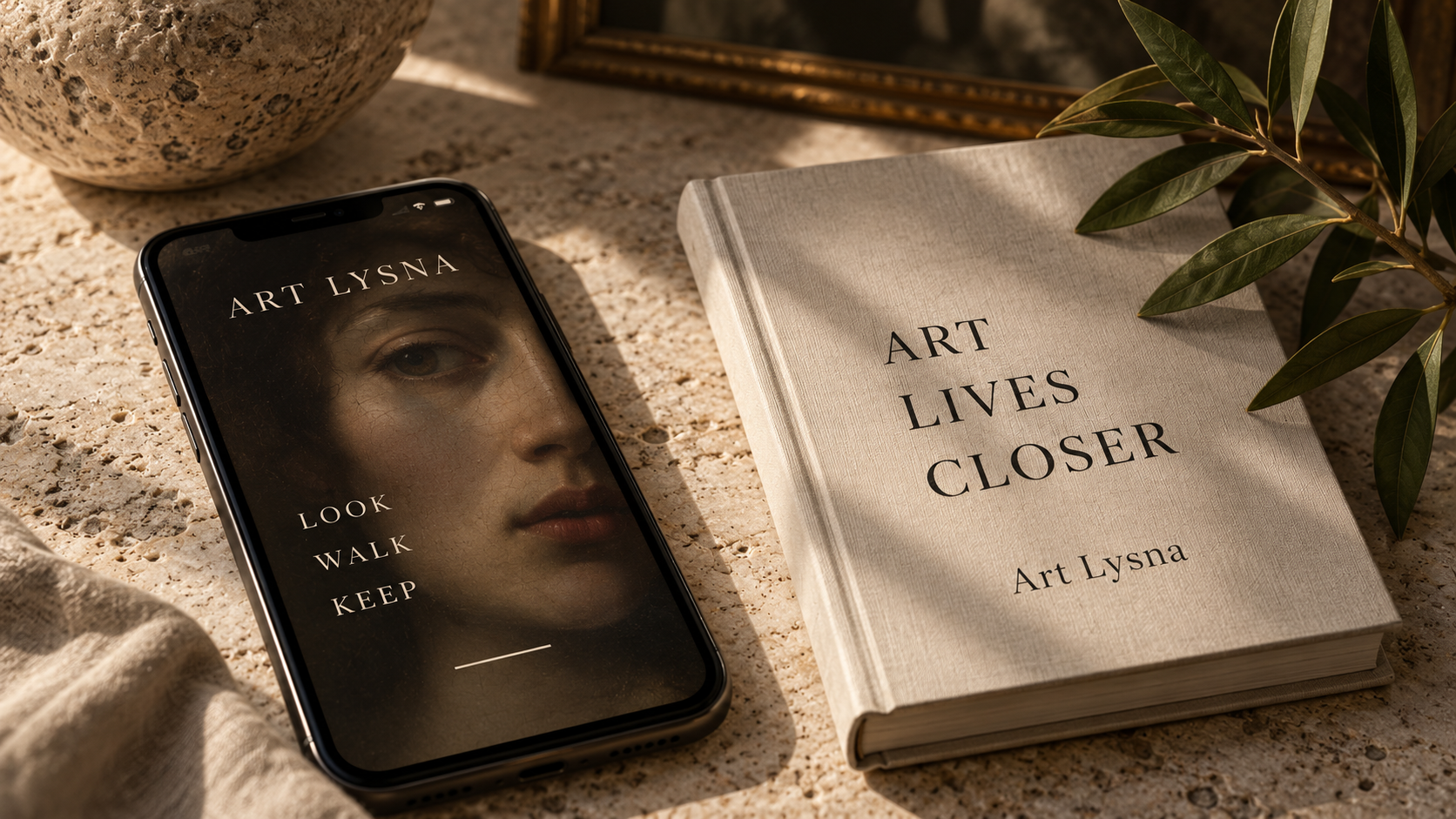 Art Lysna app on phone beside book on warm stone surface